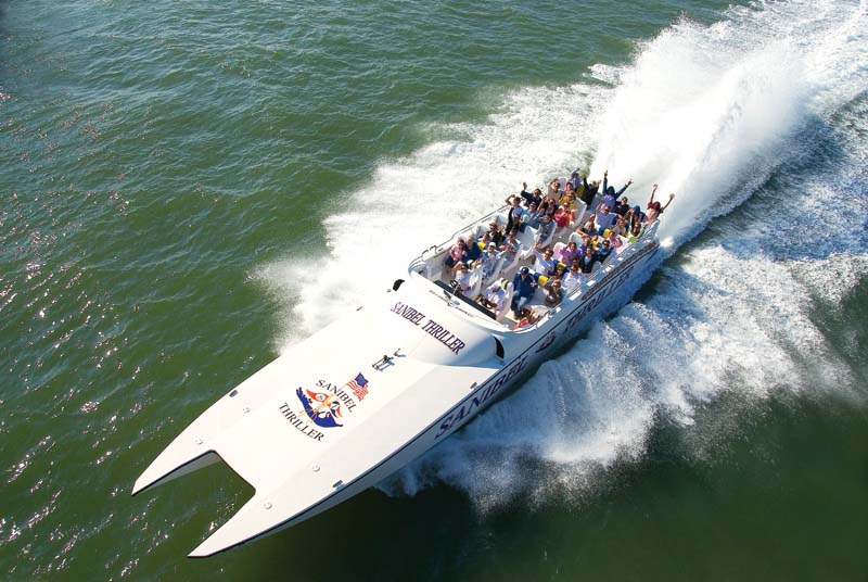 people on sanibel thriller boat in water